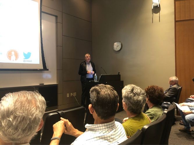 Dmitri Basov introduces John Preskill, Richard P. Feynman Professor of Physics at the California Institute of Technology, in front of crowd in Davis Auditorium at Columbia University