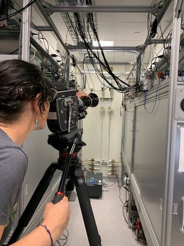 Experimental filmmaker Ramey Newell filming gauges Ramey Newell filmiing