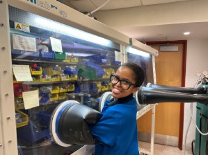Columbia MRSEC REU Student Owethu Bukula Owethu in front of a glovebox at Columbia University