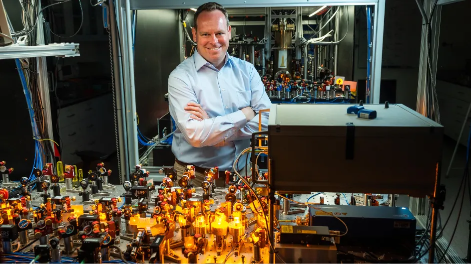 Sebastian Will in front of one of his optical tables. 